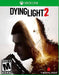 Official cover art for Dying Light 2: Stay Human on Xbox One, featuring the protagonist’s silhouette merging with a collapsing city in chaos. This open-world RPG blends intense parkour action with zombie survival. Instantly buy your Dying Light 2 Xbox One CD Key US at RushGame.co!