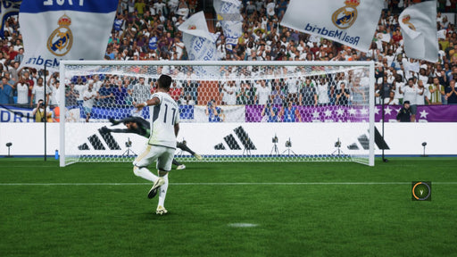 In-game screenshot - A penalty kick moment in EA Sports FC 24, with a Real Madrid player taking the shot as the goalkeeper attempts to save it. Get your EA Sports FC 24 digital key for Xbox One and Series X/S at RushGame.co for instant download