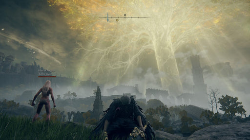 Gameplay screenshot - A lone warrior kneels beneath the towering, radiant Erdtree in Elden Ring: Shadow of the Erdtree Edition for PC Steam (EMEA). The breathtaking golden light contrasts with the dark ruins in the distance, capturing the game's epic fantasy setting. Buy your Elden Ring DLC key instantly at RushGame.co