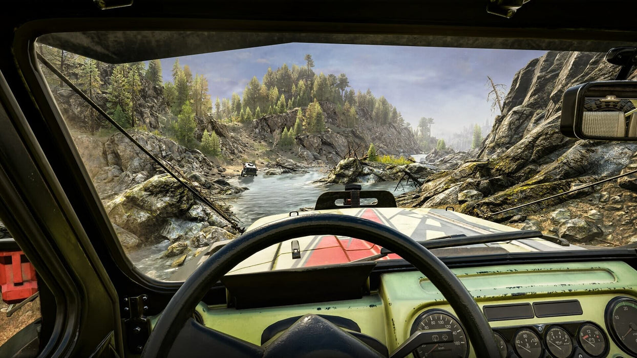 Gameplay screenshot - First-person perspective inside an off-road truck in Expeditions: A MudRunner Game for PC Steam, driving through a river with stunning natural scenery in the background. Get your digital game key at RushGame.co