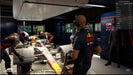 A high-quality in-game screenshot of F1 Manager 2023 for PC Steam, showing an intense pit stop with Red Bull mechanics in action. Strategize and make real-time decisions—get your game code instantly at RushGame.co