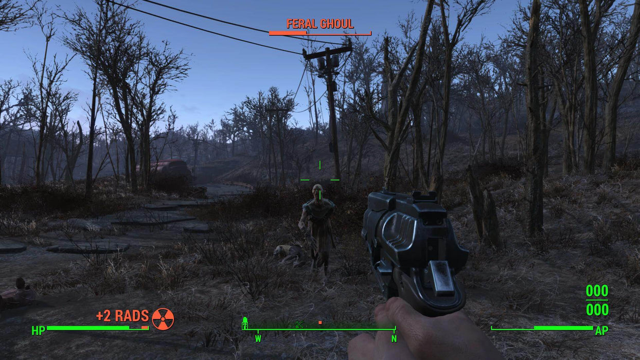 Gameplay screenshot - A player in Fallout 4: Game of the Year Edition on Xbox One aims a pistol at a charging Feral Ghoul in a dark, eerie wasteland. The health bar and radiation counter add to the tense survival experience. Get your Fallout 4 GOTY CD key for Xbox One instantly at RushGame.co