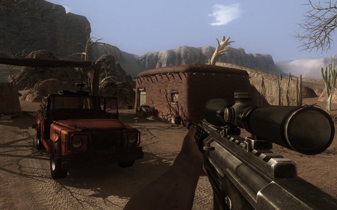 Gameplay Screenshot (PC) - Desert Outpost: Immersive desert combat scene from Far Cry 2: Fortune's Edition on PC, featuring a first-person sniper view aimed at a remote outpost with a red jeep parked nearby. Buy your digital game key at RushGame.co and conquer the battlefield today