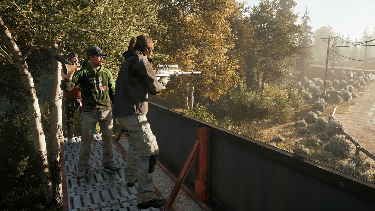 Gameplay screenshot - Tactical gameplay in Far Cry 5 on Xbox One, featuring a sniper aiming from an elevated position while allies prepare for an ambush in the wilderness of Hope County. Buy your Xbox One CD Key US now at RushGame.co and take down the Eden’s Gate cult