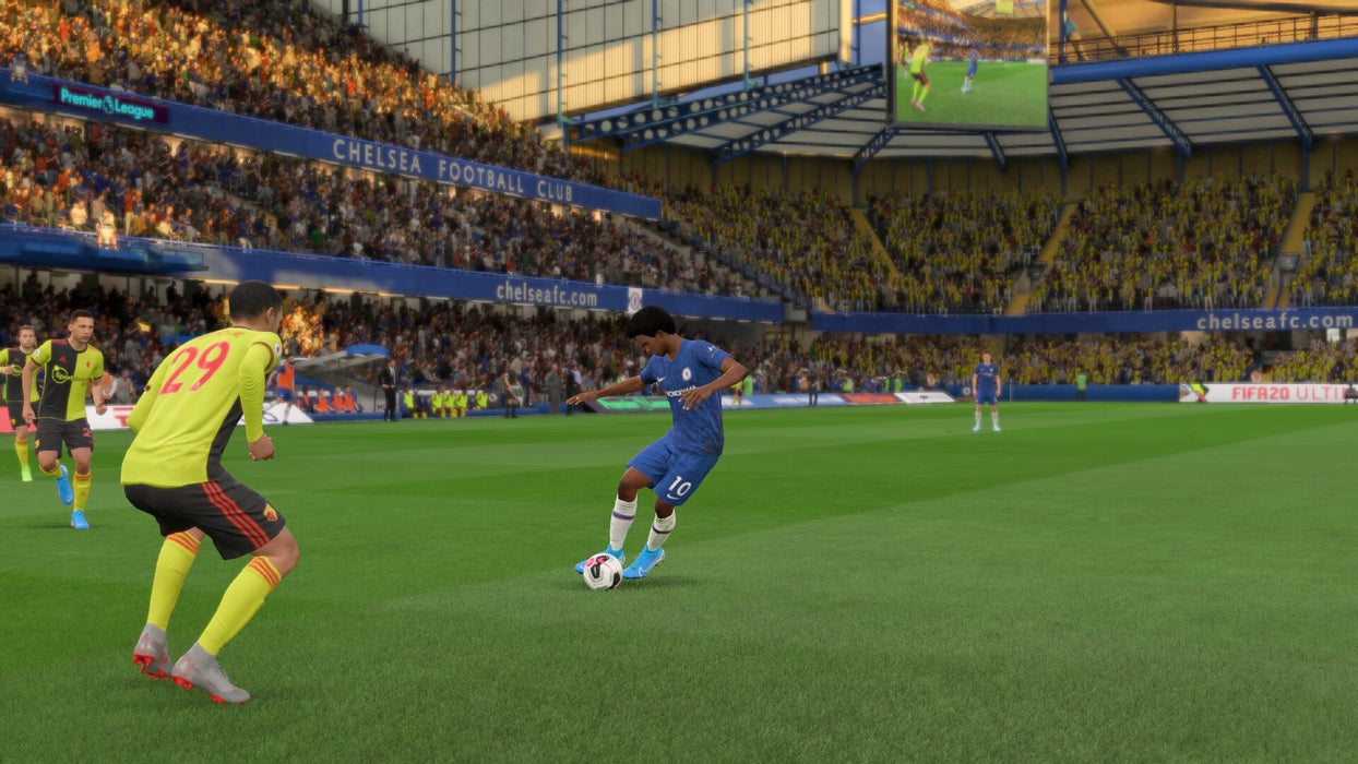 FIFA 20 Ultimate Edition Gameplay Screenshot – Chelsea Dribbling Sequence - FIFA 20 Ultimate Edition on Xbox One gameplay screenshot, showcasing a Chelsea player skillfully dribbling against Watford defenders at Stamford Bridge. Experience realistic ball control and team tactics. Get your FIFA 20 Ultimate Edition key at RushGame.co