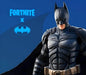 Fortnite x Batman collaboration image featuring the Dark Knight in his armored suit, standing against a blue background with the Batman logo. This exclusive crossover DLC is available as a digital game key for Fortnite on Epic Games. Purchase now at RushGame.co for instant delivery
