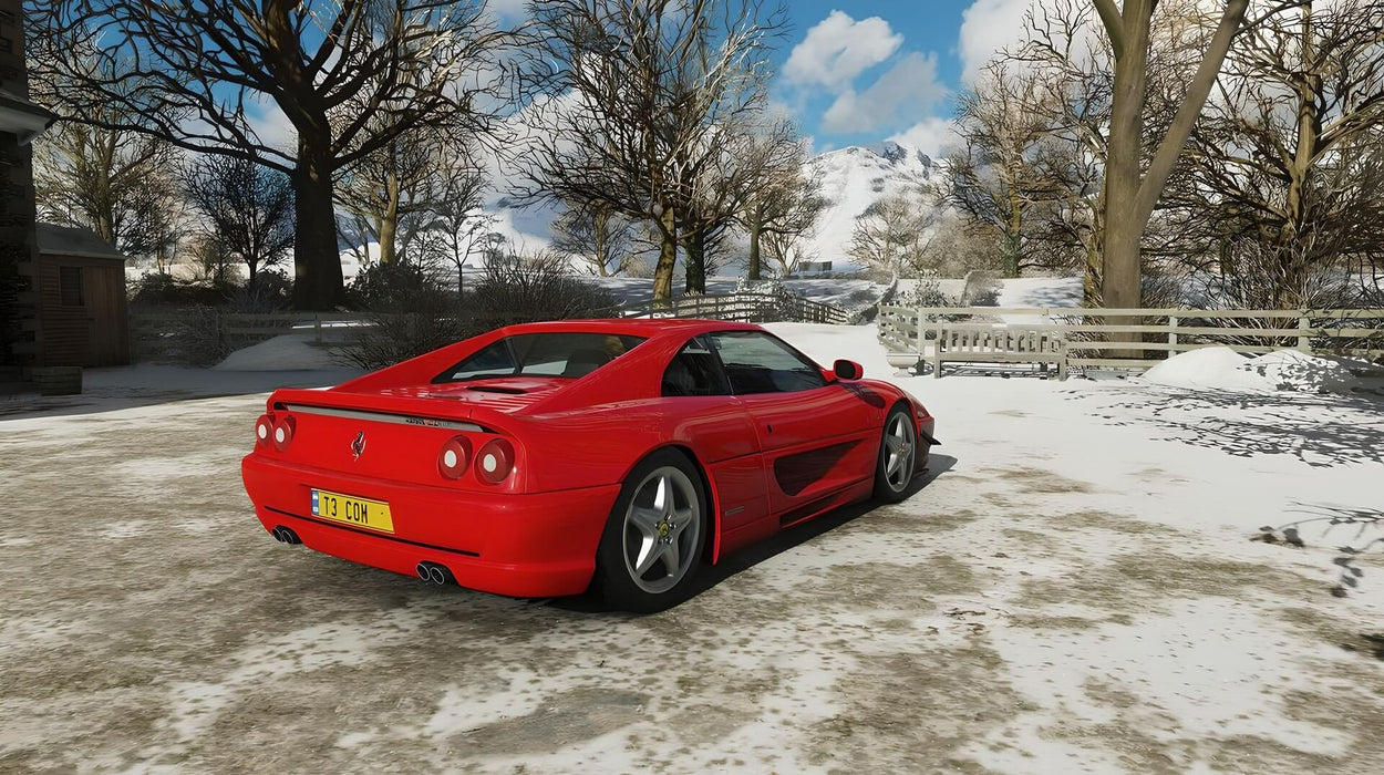 Gameplay screenshot - A classic red Ferrari F355 Berlinetta parked in a snowy countryside in Forza Horizon 4 Deluxe Edition. Drive iconic supercars through breathtaking seasonal environments. Purchase your Xbox One or Windows 10 CD key at RushGame.co