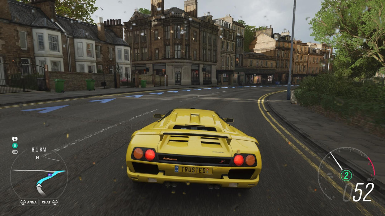 Urban race scene from Forza Horizon 4 with a yellow Lamborghini speeding through a rainy cityscape. Unlock the thrill of street racing—purchase your Forza Horizon 4 CD Key from RushGame.co