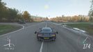 Gameplay screenshot - A sleek black Aston Martin Vulcan speeds along an open highway in Forza Horizon 4 Standard Edition. Enjoy high-speed racing in stunning seasonal environments. Get your digital game key at RushGame.co!