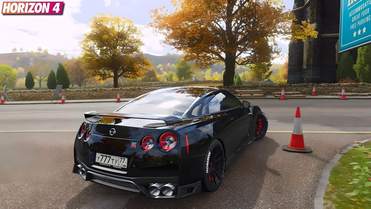 Gameplay screenshot - A black Nissan GT-R parked near a scenic countryside road with autumn leaves in Forza Horizon 4 Standard Edition. Enjoy high-speed racing and beautiful seasonal environments. Buy your Xbox One or Windows 10 CD key now at RushGame.co
