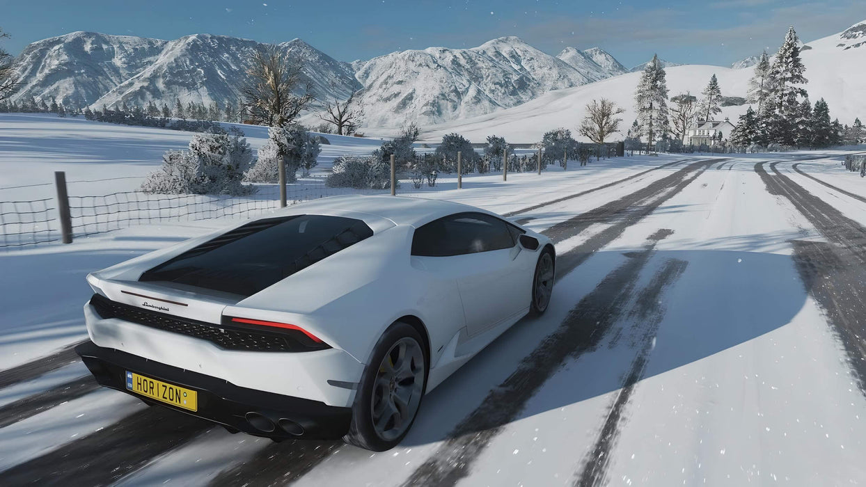 Gameplay screenshot - Lamborghini Huracán in a snowy winter landscape):
"A white Lamborghini Huracán speeding through a snowy road in Forza Horizon 4 Standard Edition, with stunning mountain scenery in the background. Discover dynamic weather and seasonal racing. Purchase your Xbox One or Windows 10 CD key now at RushGame.co