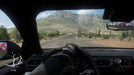 Gameplay screenshot - A first-person driving view in Forza Horizon 5 Deluxe Edition, showcasing the immersive cockpit perspective as a driver navigates through the vast Mexican landscape. Get your game key at RushGame.co and enjoy the most immersive racing experience with realistic handling and visuals