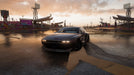 Gameplay screenshot - A classic Nissan Silvia parked on a wet racetrack at sunset in Forza Horizon 5 Deluxe Edition, capturing the stunning weather effects and realistic reflections. Get your game key at RushGame.co and take part in dynamic racing challenges across Mexico