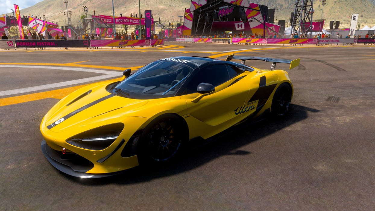 Gameplay screenshot - A bright yellow McLaren 720S parked at the Horizon Festival in Forza Horizon 5, surrounded by vibrant banners and cheering crowds. Get your Forza Horizon 5 Standard Edition Xbox and PC key at RushGame.co and compete in the ultimate festival of speed
