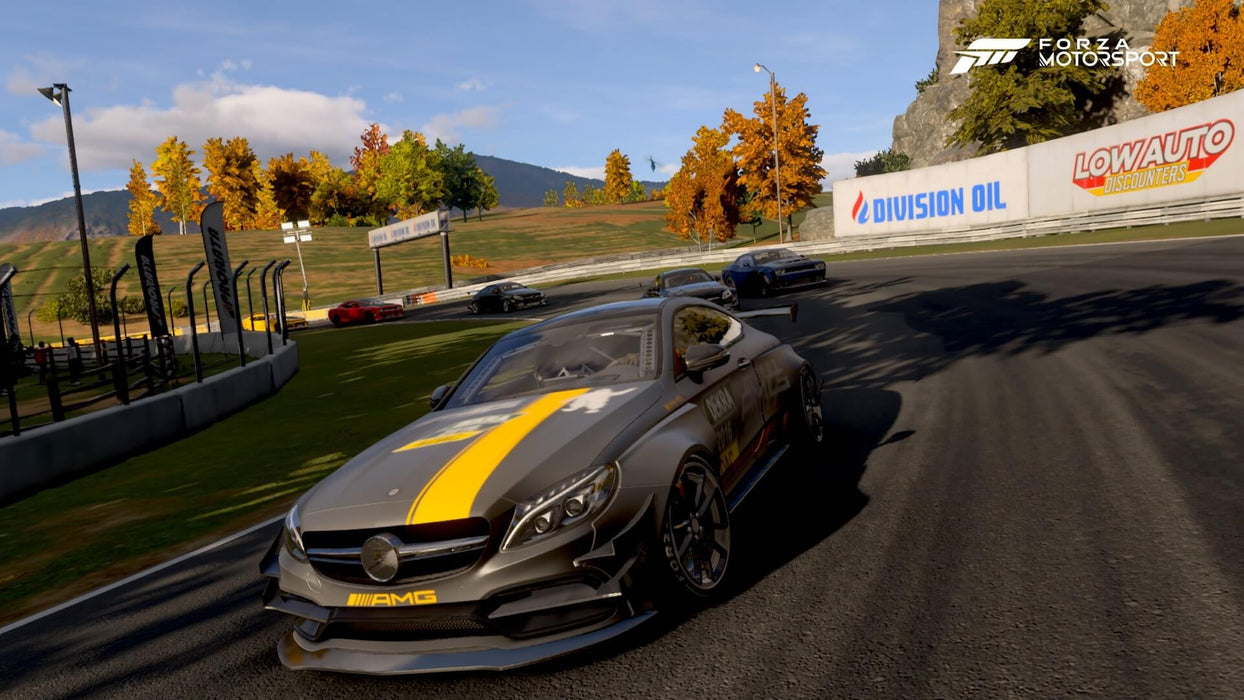 Close-up of a sleek Mercedes AMG with gray and yellow paintwork racing in Forza Motorsport 8 Deluxe Edition Xbox Series X/S & PC Win 10 CD Key US during an autumn track event