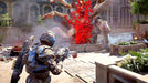 Gameplay screen - A Gears of War 4 player in full combat armor faces a massive exploding Swarm creature in an urban environment. Experience adrenaline-fueled action—get your Gears of War 4 Xbox One CD Key US at RushGame.co today!