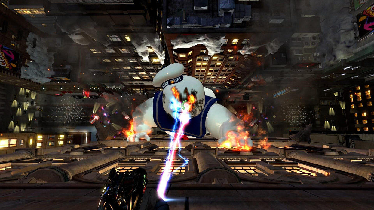 Gameplay screenshot - Epic battle against the Stay Puft Marshmallow Man in Ghostbusters: The Video Game Remastered on PC, as players blast the giant ghost with powerful proton streams from a rooftop. Join the Ghostbusters and save the city—get your Steam CD Key now at RushGame.co