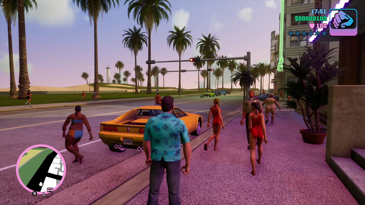 Gameplay screenshot from Grand Theft Auto: Vice City - The Definitive Edition on Xbox One, showing Tommy Vercetti walking near palm-lined streets with a classic sports car in the background. Buy your GTA Trilogy Xbox One digital key at RushGame.co