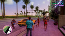 Gameplay screenshot from Grand Theft Auto: Vice City - The Definitive Edition on Xbox One, showing Tommy Vercetti walking near palm-lined streets with a classic sports car in the background. Buy your GTA Trilogy Xbox One digital key at RushGame.co