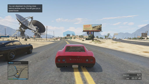 Gameplay screenshot - A red sports car speeds through the desert highway in Grand Theft Auto V online multiplayer mode. Compete in thrilling races and boost your in-game wealth with the Great White Shark Cash Card—available at RushGame.co