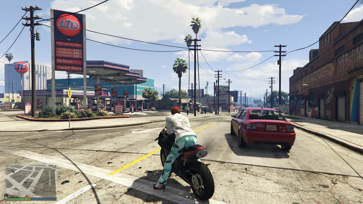 Gameplay screenshot - A biker accelerates past a gas station in Los Santos in Grand Theft Auto V for Xbox One. Explore the vibrant streets of GTA Online and boost your in-game wealth with the Great White Shark Card—available now at RushGame.co