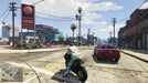 Gameplay screenshot - A biker accelerates past a gas station in Los Santos in Grand Theft Auto V for Xbox One. Explore the vibrant streets of GTA Online and boost your in-game wealth with the Great White Shark Card—available now at RushGame.co