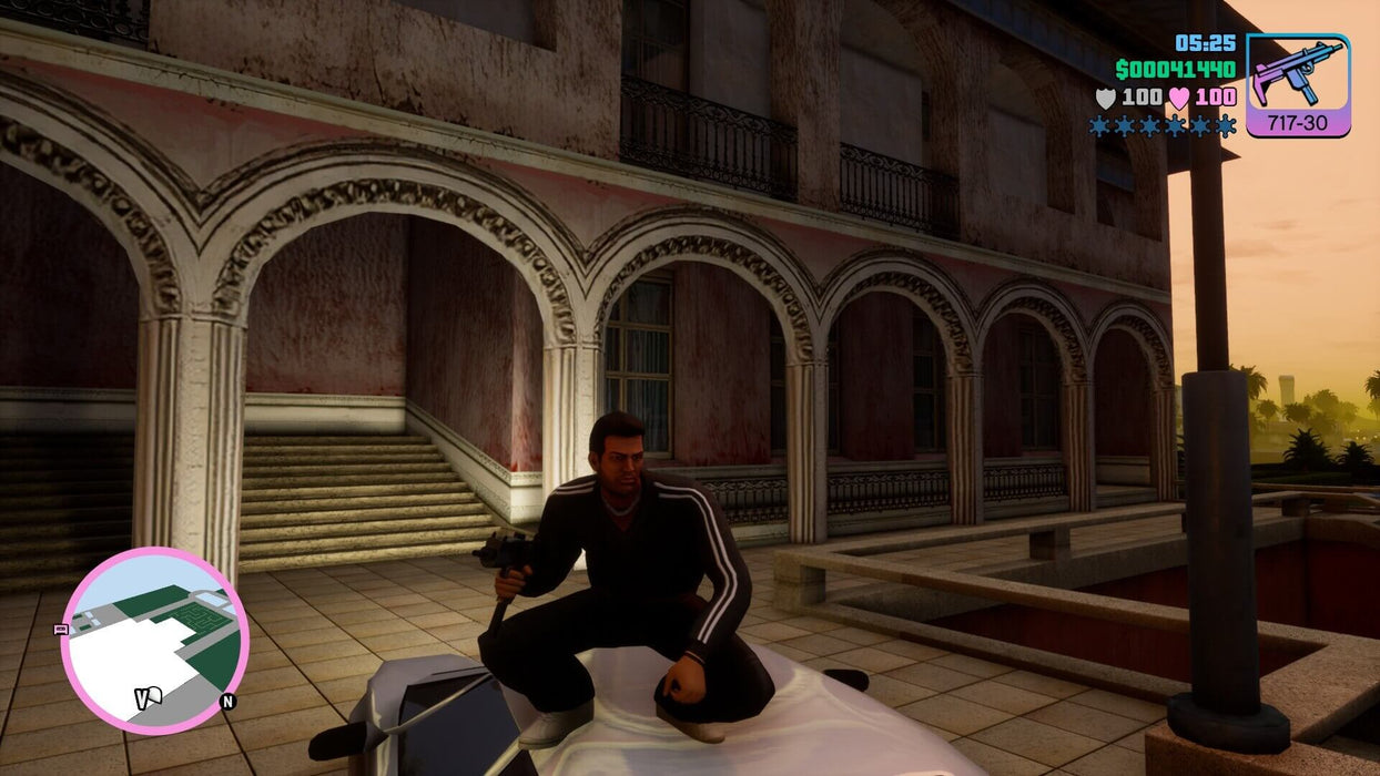 Gameplay screenshot - Tommy Vercetti Armed at the Mansion
"Grand Theft Auto: Vice City gameplay on PC Steam, showing Tommy Vercetti crouching on a car, armed with an SMG in front of a grand mansion at dawn. Buy your GTA Vice City Steam CD Key now at RushGame.co