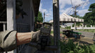 Gameplay screenshot - Gray Zone Warfare gameplay on PC Steam, featuring a first-person view of a soldier aiming from behind cover in a rural village. Get your Gray Zone Warfare digital key at RushGame.co for instant activation