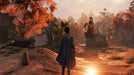 Game image - A lone adventurer in GreedFall for PC Steam, walking through an autumnal landscape filled with ruins and golden foliage. Discover uncharted lands—get your GreedFall activation key today at RushGame.co