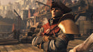 Gameplay screen - Close-up of a warrior in GreedFall for PC Steam, wearing a tricorn hat and colonial-style armor, standing in a bustling port town. Buy your GreedFall activation key now at RushGame.co and explore a world of intrigue and magic