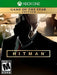 Cover art for HITMAN Game of the Year Edition on Xbox One, showcasing Agent 47 in a signature pose with a pistol, surrounded by scenes of espionage, disguises, and tactical assassinations. Grab your Xbox One CD Key (US) today at RushGame.co and experience elite stealth gameplay with instant digital delivery