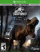 Cover image of Jurassic World Evolution Deluxe Edition for Xbox One, featuring a fierce T-Rex roaring inside a high-security enclosure. Explore enhanced gameplay with extra content—buy your Xbox One CD key now at RushGame.co and build your ultimate dinosaur park today