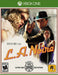Cover art of L.A. Noire for Xbox One featuring detective Cole Phelps and a noir-styled cast in dramatic 1940s Hollywood atmosphere. Buy your Xbox digital game key today at RushGame.co and dive into Rockstar's gripping crime thriller in 4K UHD