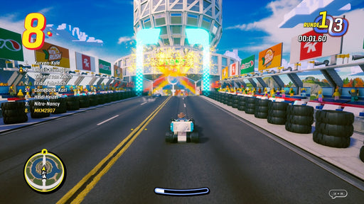 In-game screenshot from LEGO 2K Drive: Awesome Edition on PC Epic Games showing a player driving a kart past colorful LEGO spectators near a lit-up finish line – buy the digital key now at RushGame.co
