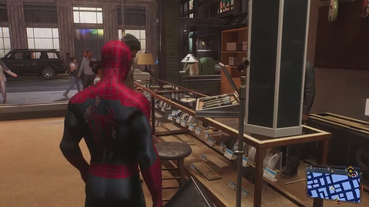 Spider-Man takes a moment inside a shop, observing a display of gadgets in Marvel's Spider-Man 2 on PS5. Step into the everyday life of Peter Parker and swing into action by getting your PS5 game key at RushGame.co