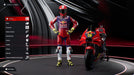 MotoGP 24 Rider Customization PC Steam – A detailed character customization screen in MotoGP 24, showing a Red Bull-sponsored rider alongside their race bike. Buy MotoGP 24 for PC on Steam at RushGame.co