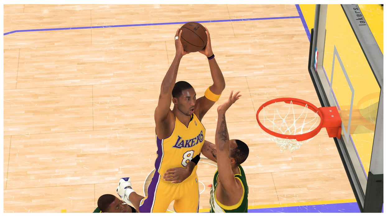 Action-packed moment from NBA 2K24 featuring Kobe Bryant in his Lakers jersey, executing a powerful shot under the rim. Buy NBA 2K24 Kobe Bryant Edition Xbox Series X|S CD Key now at RushGame.co and relive iconic NBA moments