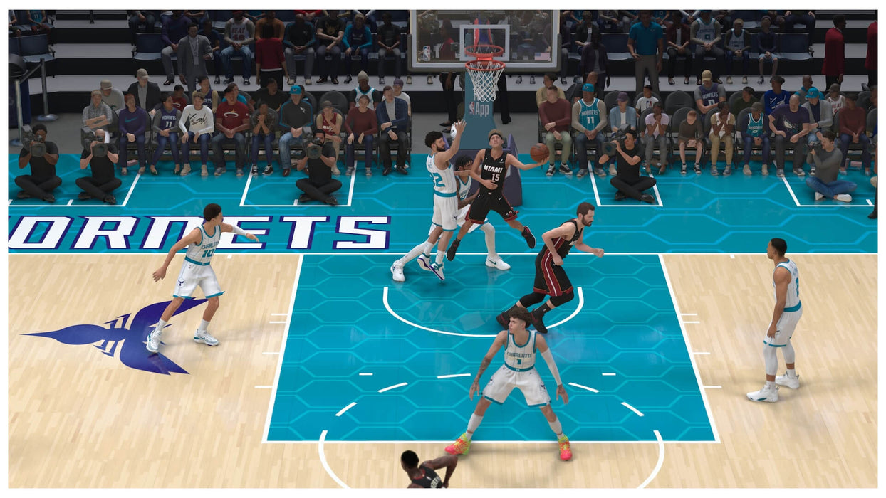 Gameplay image from NBA 2K25 showcasing a match between the Miami Heat and Charlotte Hornets with realistic court and crowd detail. Purchase your Xbox Series X|S CD key now at RushGame.co and step into the game