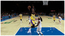 In-game screenshot from NBA 2K25 showing a Lakers player mid-air during a layup against Oklahoma City. Experience realistic NBA action with your Xbox CD key from RushGame.co