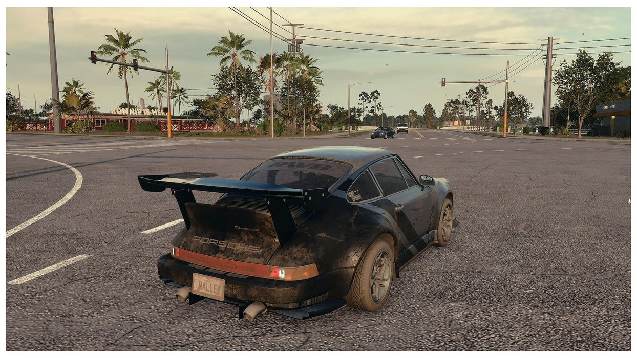  A muddy black Porsche Carrera 911 ready for action at a street intersection in NFS Heat. Get your Xbox One or Series X|S CD key for the US version today at RushGame.co
