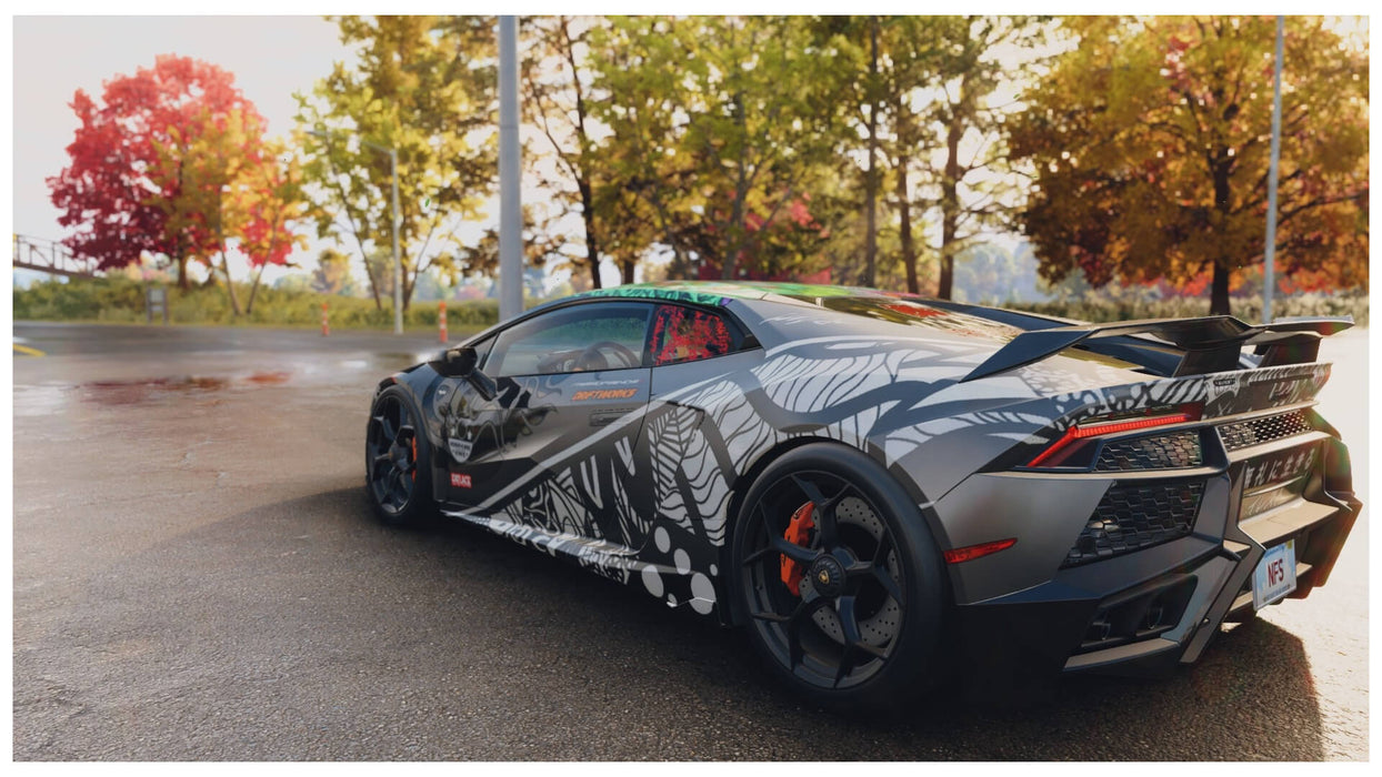 Screenshot from Need for Speed Unbound on PC, featuring a customized Lamborghini parked in a scenic autumn setting – experience urban racing action with your EA Play key from RushGame.co