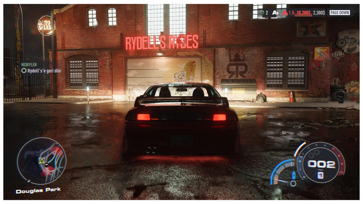 In-game view of a player’s car parked at Rydell’s Rides garage in Need for Speed Unbound – unlock the full story and customization options with your digital game key from RushGame.co