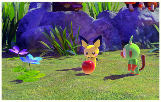 Gameplay image from New Pokémon Snap on Switch, highlighting Pichu and Grookey interacting with a red apple in a colorful natural setting – get your US CD key at RushGame.co