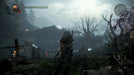 Gameplay screenshot from Nioh 2 showing a player character overlooking a haunting battlefield under a cloudy sky, ready to face demonic foes. Get your Nioh 2 Steam game key today from RushGame.co