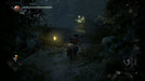 In-game scene from Nioh 2: the samurai approaches a glowing shrine in a dark, misty forest, highlighting the atmospheric design and exploration. Activate your Steam key instantly from RushGame.co
