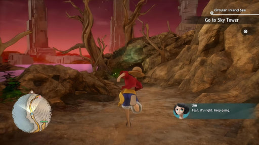 Exploration gameplay in One Piece Odyssey for Steam, with Luffy running through a rocky path toward the Sky Tower at sunset. Purchase the PC digital code now on RushGame.co.