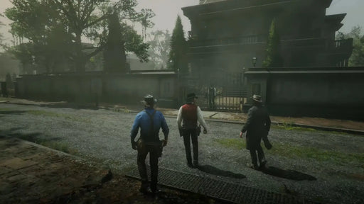 The gang walks up to a grand estate in a misty town environment. Order your Red Dead Redemption 2 Ultimate Edition key at RushGame.co and explore story-rich gameplay