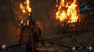Remnant II gameplay image on PC showing the player navigating a fiery corridor with buildings engulfed in flames. Purchase your Remnant II Deluxe Edition Steam key at RushGame.co for an epic survival experience