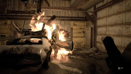 oss battle in Resident Evil 7 Gold Edition featuring a flaming enemy in a dark garage, available in the PC Steam bundle at RushGame.co