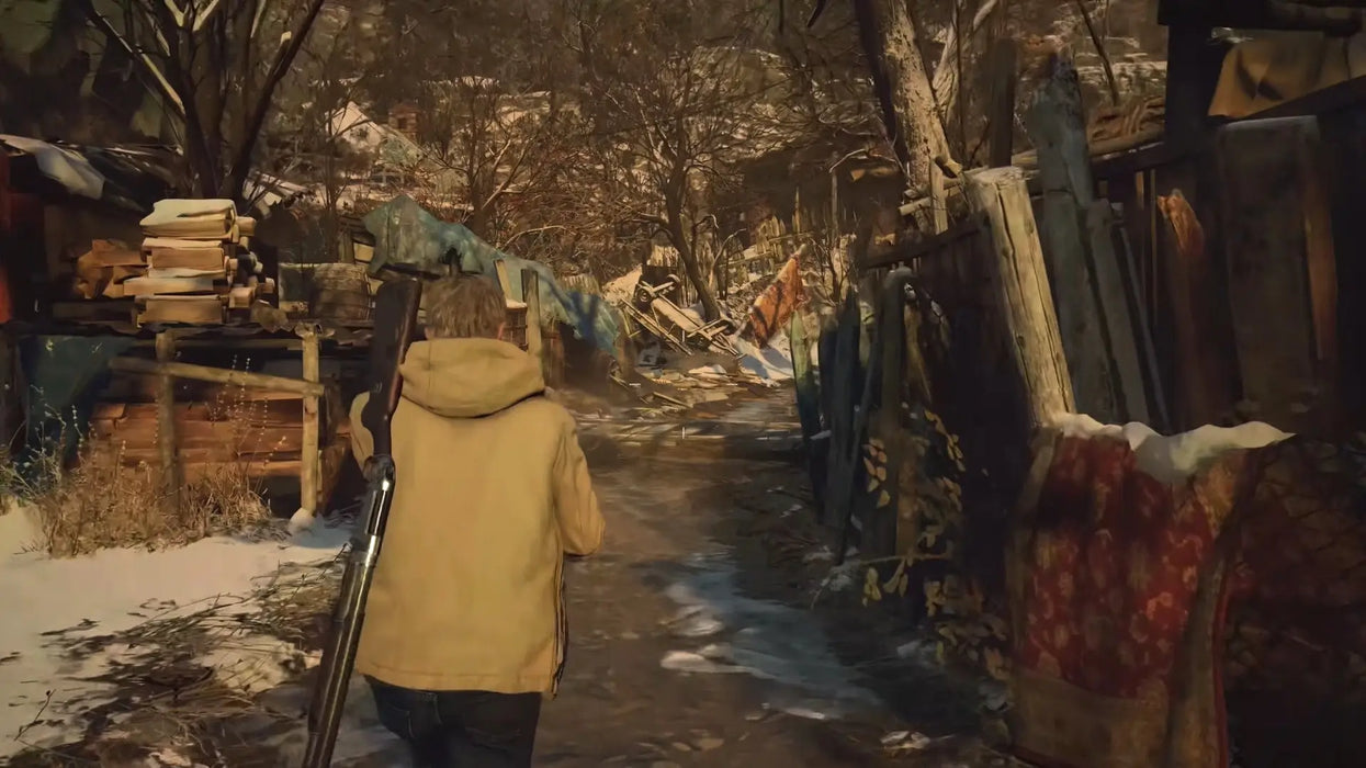 A character walks through a snowy, abandoned village path in Resident Evil Village Gold Edition, part of the PC Steam game bundle available at RushGame.co